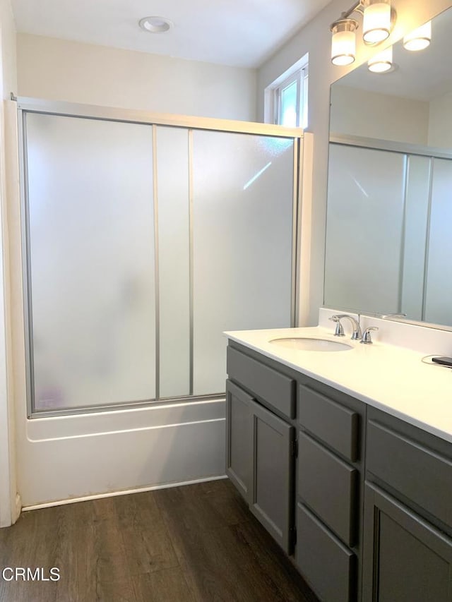 1123 Paseo Las Nubes, Oxnard, CA 93030 - full bath featuring vanity, wood finished floors, and shower / bath combination with glass door