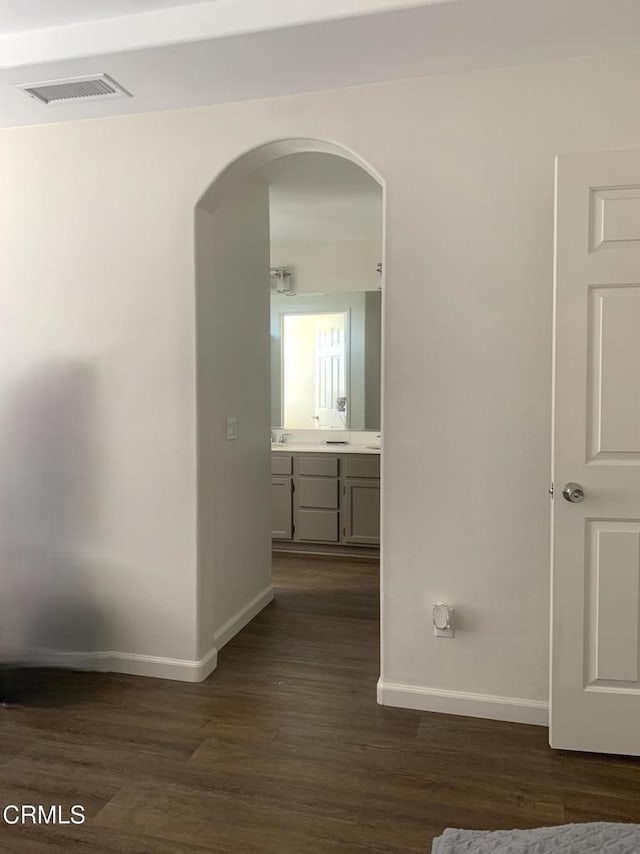 1123 Paseo Las Nubes, Oxnard, CA 93030 - corridor with arched walkways and dark wood-type flooring