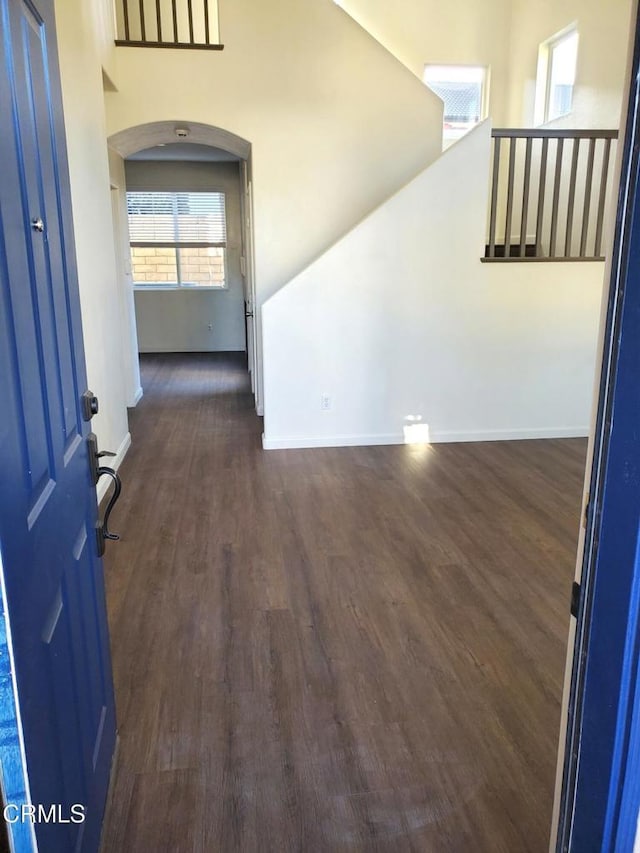 1123 Paseo Las Nubes, Oxnard, CA 93030 - empty room with dark wood-type flooring and arched walkways