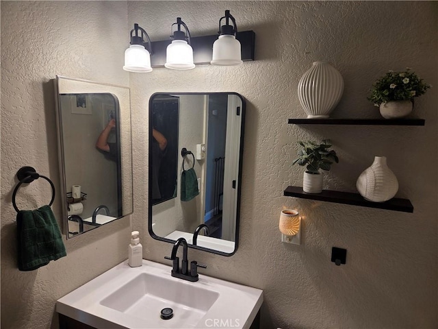1292 N California Ave, Beaumont, CA 92223 - bathroom with vanity and a textured wall