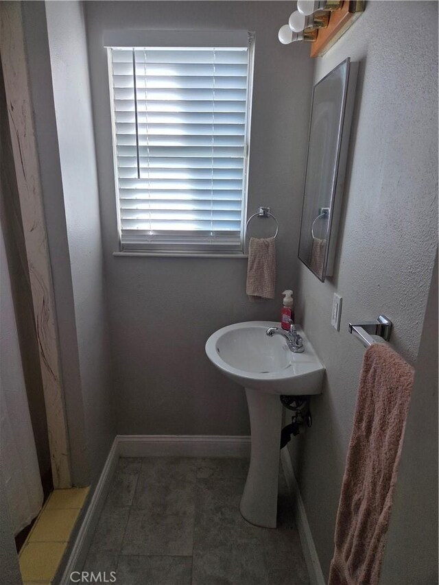 1292 N California Ave, Beaumont, CA 92223 - bathroom with baseboards and a sink