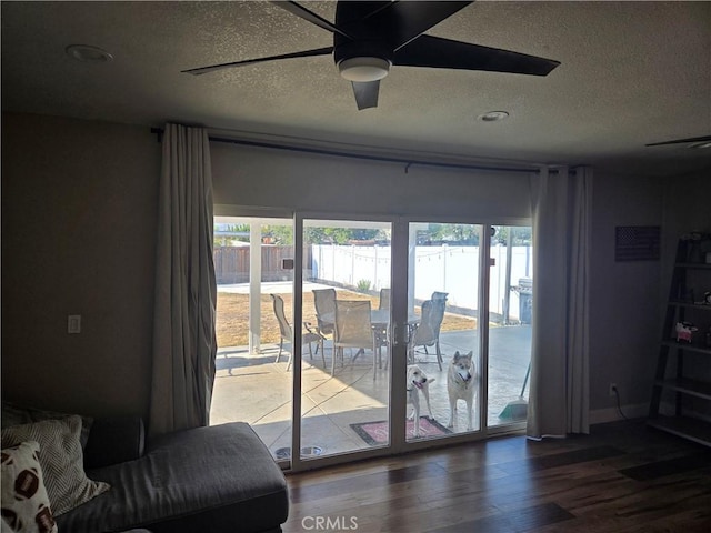 1292 N California Ave, Beaumont, CA 92223 - entryway with a textured ceiling, a ceiling fan, plenty of natural light, and wood finished floors