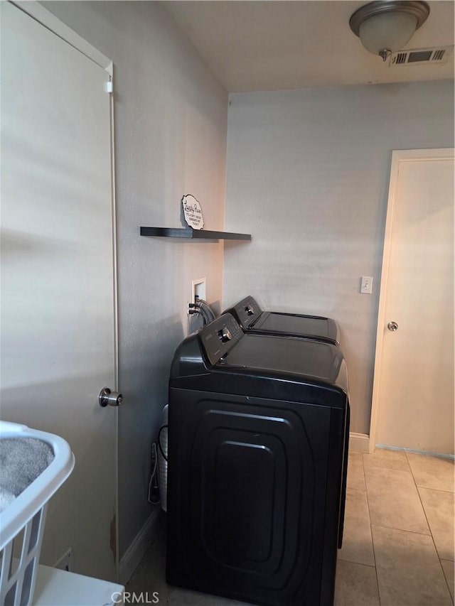 1292 N California Ave, Beaumont, CA 92223 - laundry room with washing machine and clothes dryer and tile patterned floors