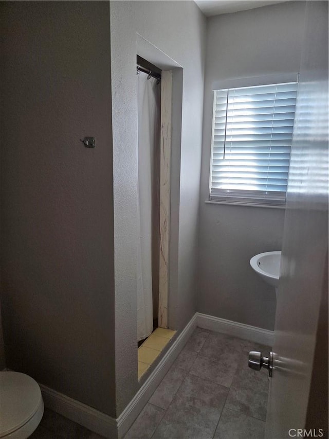 1292 N California Ave, Beaumont, CA 92223 - bathroom featuring a shower with curtain and tile patterned flooring