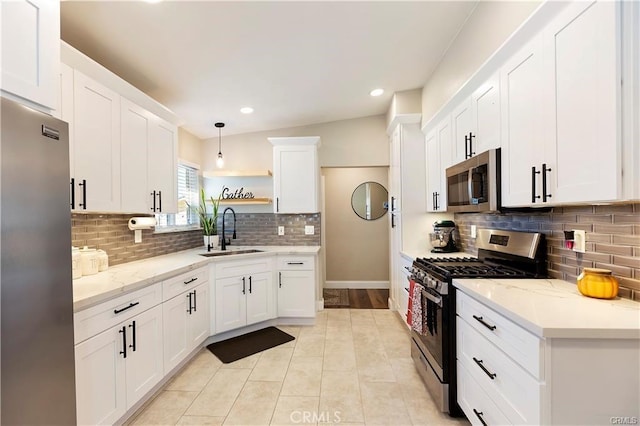 1292 N California Ave, Beaumont, CA 92223 - kitchen with stainless steel appliances, open shelves, white cabinets, tasteful backsplash, and recessed lighting