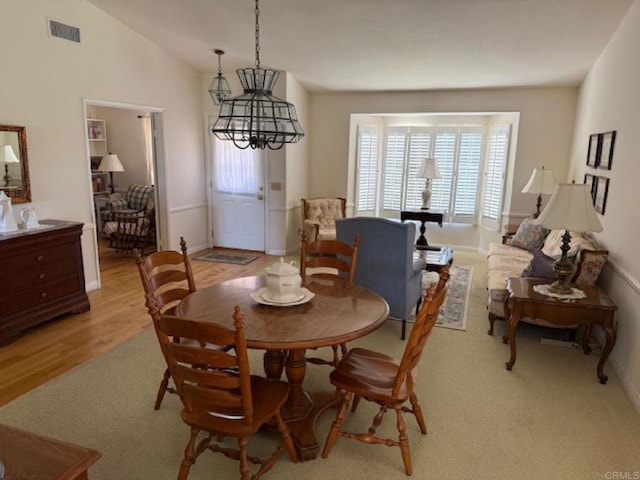 1633 Willowspring Dr N, Encinitas, CA 92024 - dining area featuring light wood-style floors and vaulted ceiling