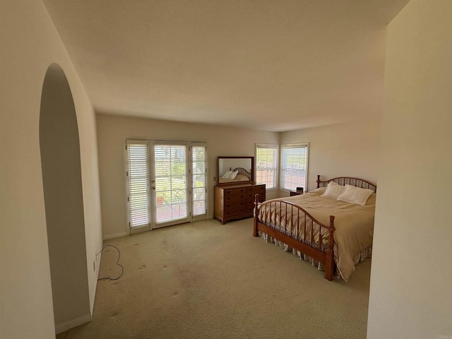 1633 Willowspring Dr N, Encinitas, CA 92024 - bedroom with arched walkways, carpet floors, and access to outside