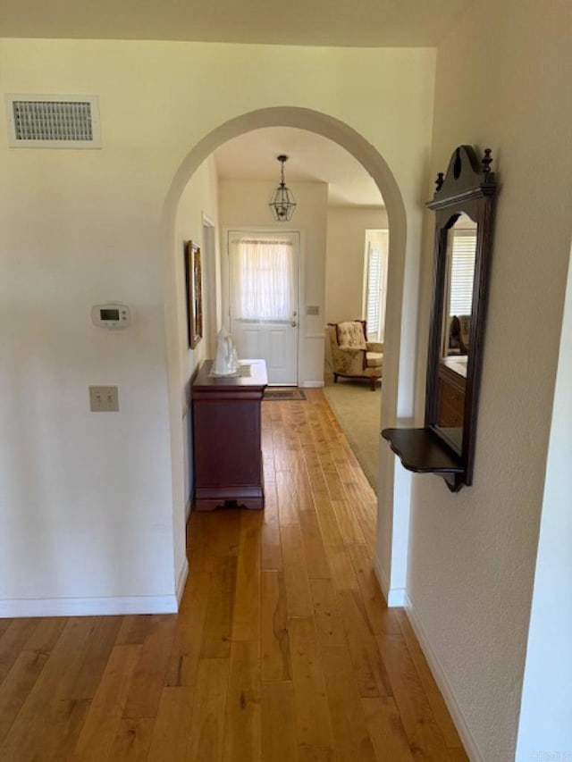 1633 Willowspring Dr N, Encinitas, CA 92024 - corridor with arched walkways and light wood-style flooring