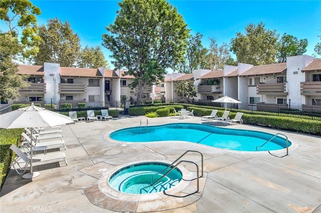 17574 Vandenberg Ln Unit 1, Tustin, CA 92780 - community pool featuring a community hot tub, a patio, and a residential view