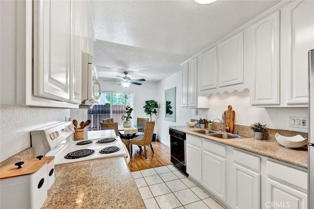 17574 Vandenberg Ln Unit 1, Tustin, CA 92780 - kitchen with white appliances, white cabinets, a textured ceiling, a ceiling fan, and light tile patterned flooring