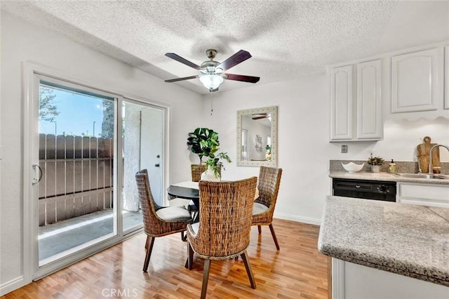 17574 Vandenberg Ln Unit 1, Tustin, CA 92780 - dining area featuring light wood-style flooring, a textured ceiling, and a ceiling fan