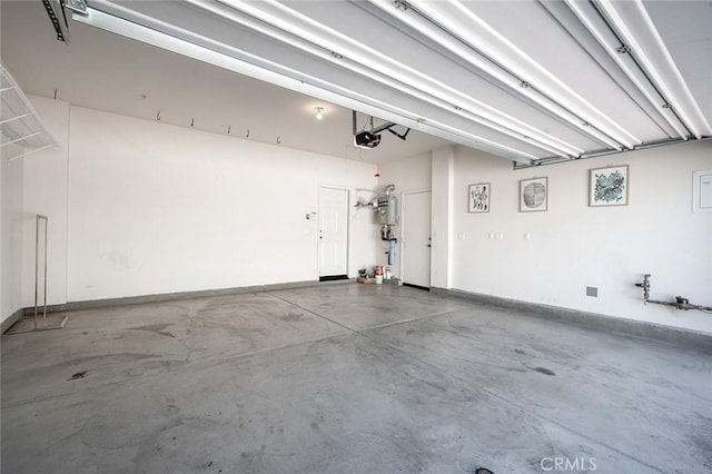 28419 Sunflower St, Highland, CA 92346 - garage with a garage door opener and baseboards