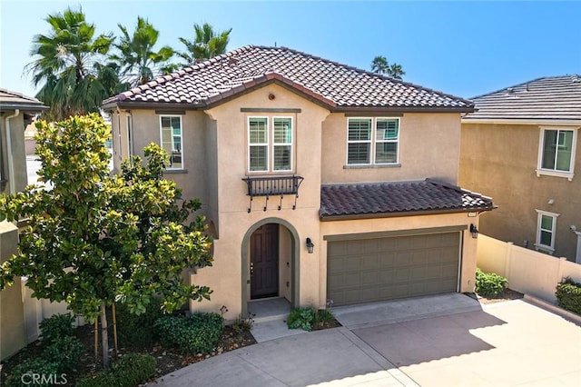 28419 Sunflower St, Highland, CA 92346 - mediterranean / spanish home featuring a tile roof, stucco siding, concrete driveway, and an attached garage