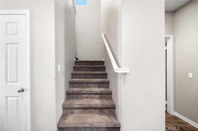 28419 Sunflower St, Highland, CA 92346 - staircase featuring wood finished floors and baseboards