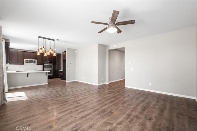 28419 Sunflower St, Highland, CA 92346 - unfurnished living room with a ceiling fan, wood finished floors, and a chandelier