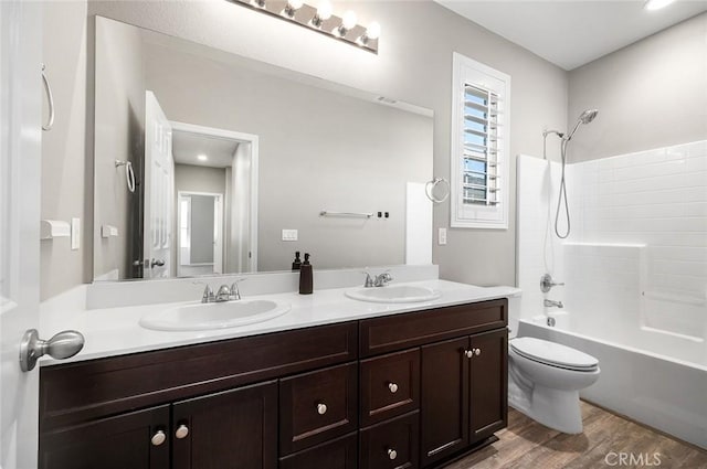 28419 Sunflower St, Highland, CA 92346 - bathroom with double vanity, shower / bath combination, and wood finished floors