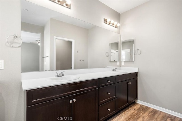 28419 Sunflower St, Highland, CA 92346 - full bathroom with double vanity and wood finished floors