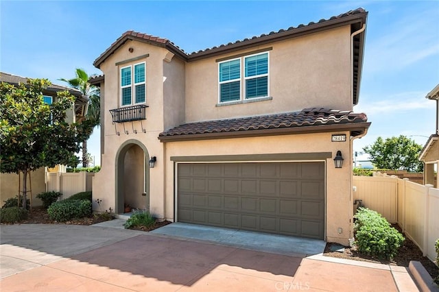 28419 Sunflower St, Highland, CA 92346 - mediterranean / spanish house featuring a tiled roof, concrete driveway, stucco siding, and an attached garage
