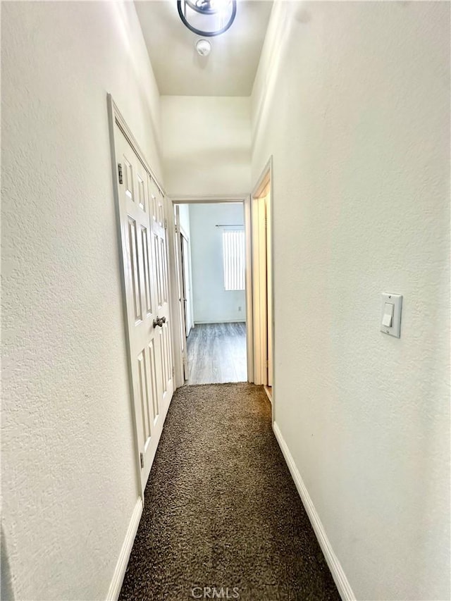 3415 Genoa Pl, Palmdale, CA 93551 - hallway with carpet flooring and a textured wall