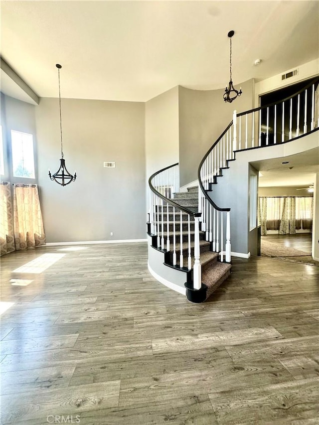 3415 Genoa Pl, Palmdale, CA 93551 - stairway with healthy amount of natural light and wood finished floors