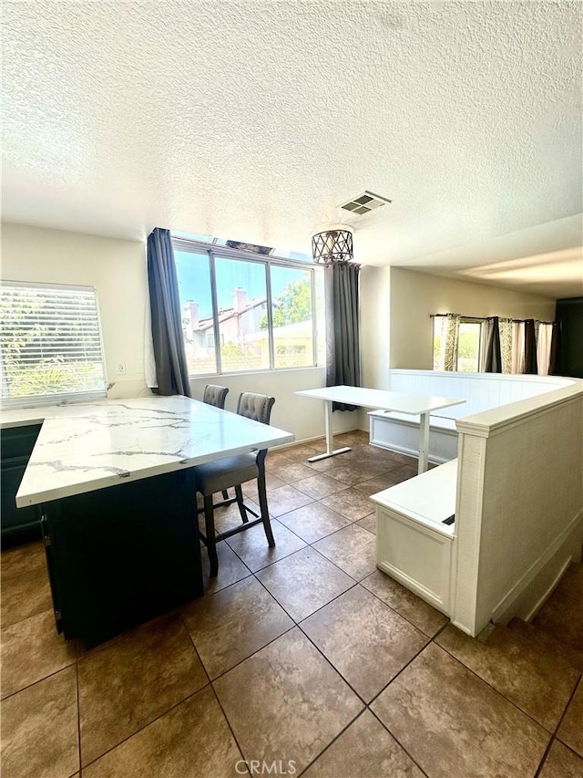 3415 Genoa Pl, Palmdale, CA 93551 - dining space featuring a textured ceiling and tile patterned floors