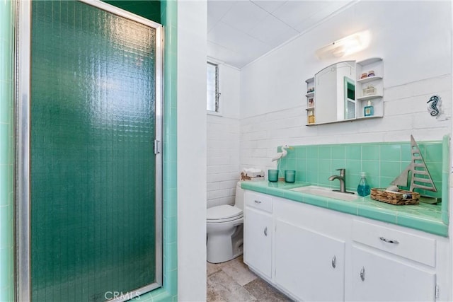 7932 Rhea Vista Dr, Whittier, CA 90602 - bathroom with a stall shower, vanity, and tile walls