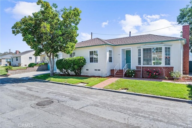 7932 Rhea Vista Dr, Whittier, CA 90602 - view of front of home with a front lawn, stucco siding, and a chimney