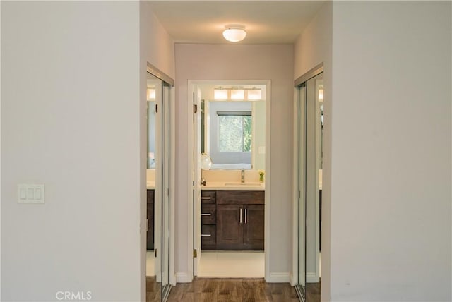 334 California St Unit D, Arcadia, CA 91006 - corridor with a sink and dark wood-style flooring