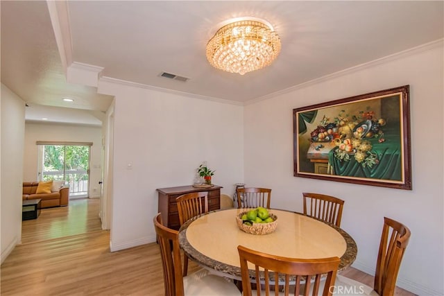 334 California St Unit D, Arcadia, CA 91006 - dining space with crown molding, a chandelier, and light wood finished floors