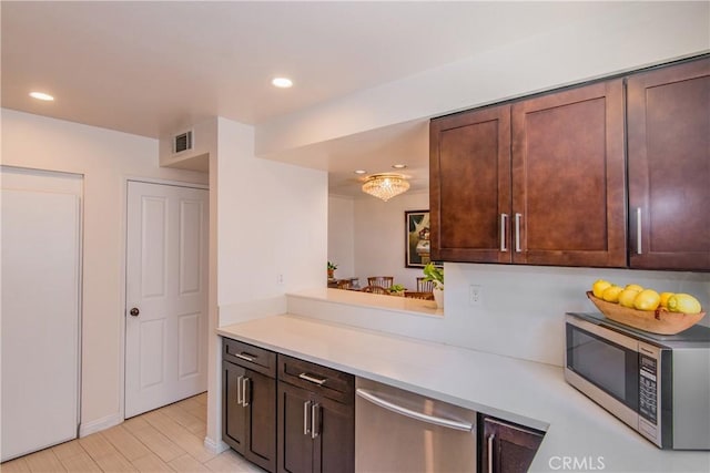 334 California St Unit D, Arcadia, CA 91006 - kitchen with stainless steel appliances, light countertops, recessed lighting, and dark brown cabinets