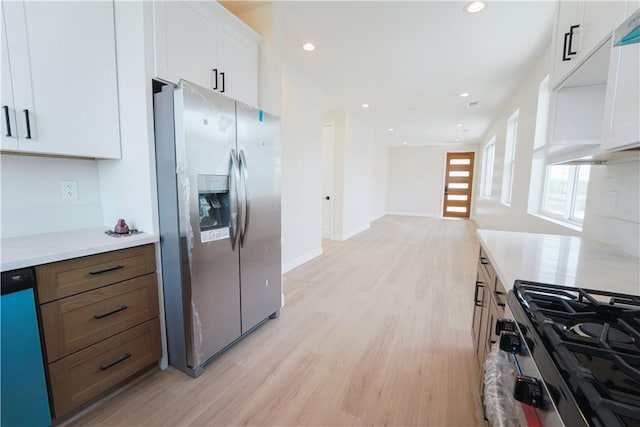 630 N Juniper St, Escondido, CA 92025 - kitchen with appliances with stainless steel finishes, light wood-style flooring, light countertops, white cabinetry, and recessed lighting