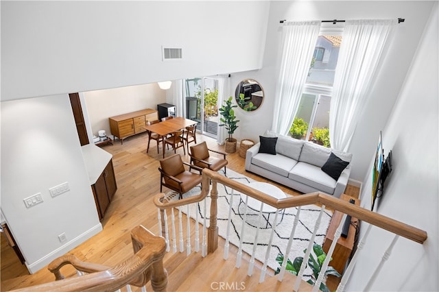 29426 Via Napoli Unit 121, Laguna Niguel, CA 92677 - living area featuring light wood-style flooring and baseboards