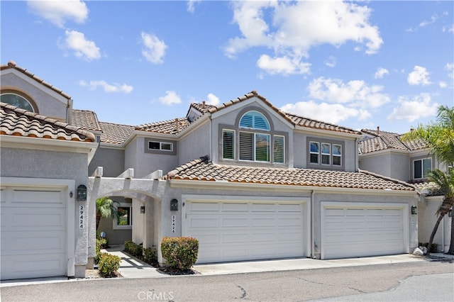 29426 Via Napoli Unit 121, Laguna Niguel, CA 92677 - mediterranean / spanish-style house with a tiled roof and stucco siding