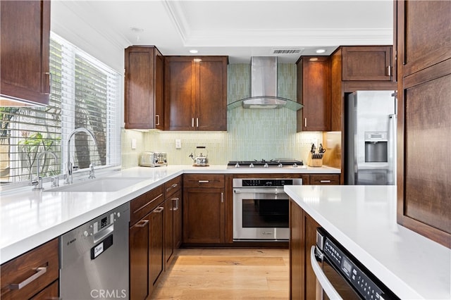 29426 Via Napoli Unit 121, Laguna Niguel, CA 92677 - kitchen with appliances with stainless steel finishes, wall chimney range hood, light countertops, ornamental molding, and decorative backsplash