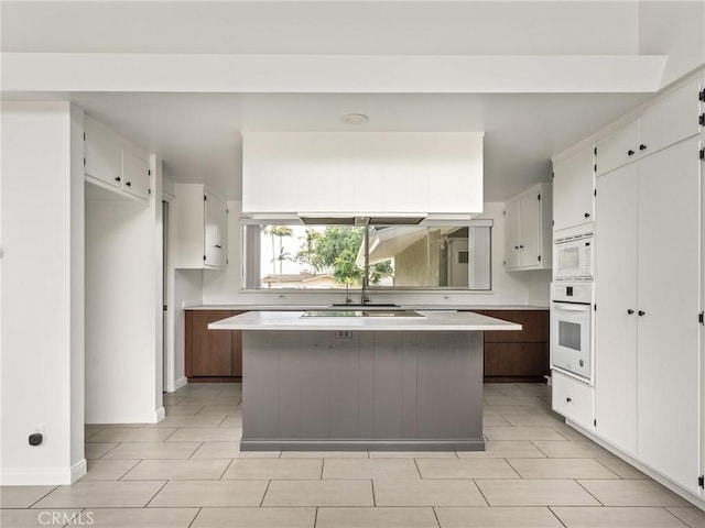 2640 Via Anacapa, Palos Verdes Estates, CA 90274 - kitchen with white appliances, light countertops, a center island, and white cabinetry