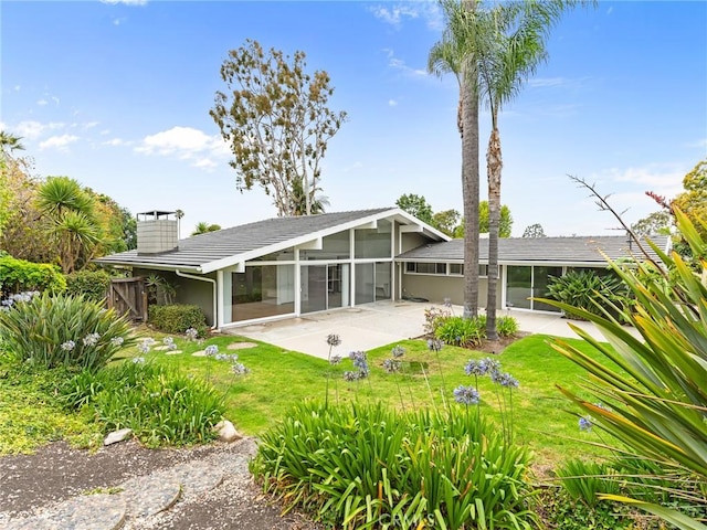 2640 Via Anacapa, Palos Verdes Estates, CA 90274 - back of house with a sunroom, a patio, and a chimney