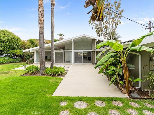 2640 Via Anacapa, Palos Verdes Estates, CA 90274 - rear view of house with a lawn, a patio, and a sunroom