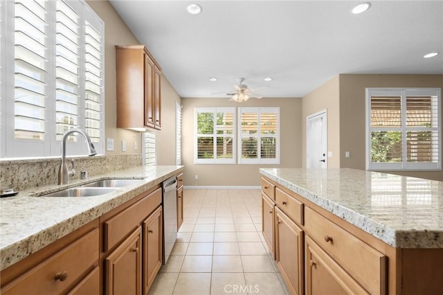 26135 Palm Breeze Ln, Menifee, CA 92586 - kitchen with plenty of natural light, recessed lighting, ceiling fan, light tile patterned floors, and light stone countertops