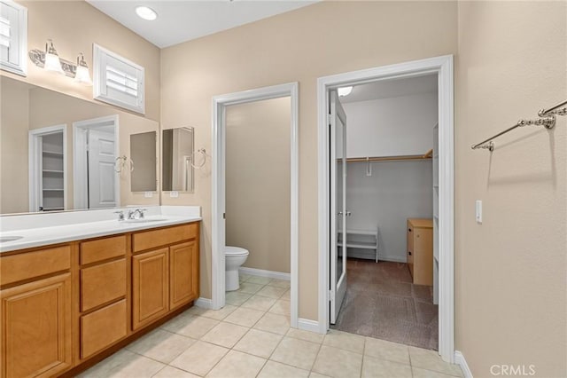 26135 Palm Breeze Ln, Menifee, CA 92586 - full bath featuring a walk in closet, double vanity, and tile patterned floors