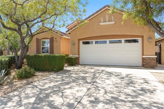 26135 Palm Breeze Ln, Menifee, CA 92586 - view of front of home featuring stone siding, concrete driveway, stucco siding, and a garage