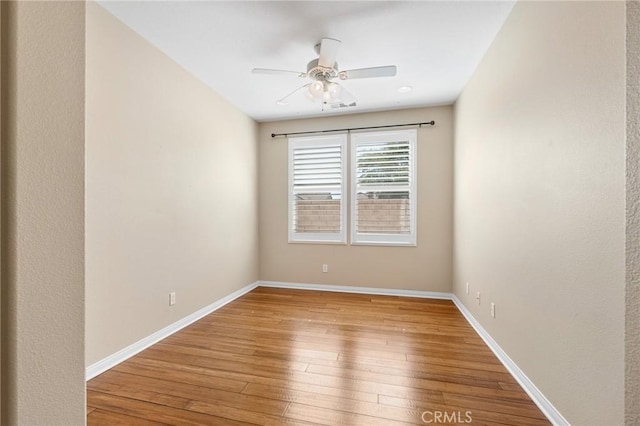 26135 Palm Breeze Ln, Menifee, CA 92586 - empty room featuring a ceiling fan and wood-type flooring