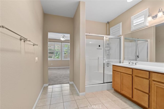 26135 Palm Breeze Ln, Menifee, CA 92586 - bathroom featuring a shower stall, tile patterned floors, vanity, and a ceiling fan