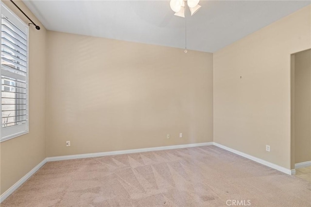 26135 Palm Breeze Ln, Menifee, CA 92586 - spare room featuring light colored carpet, a ceiling fan, and healthy amount of natural light