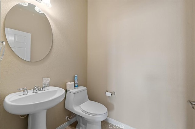 26135 Palm Breeze Ln, Menifee, CA 92586 - half bathroom with toilet and tile patterned flooring