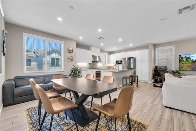 40 Riverton St, Phillips Ranch, CA 91766 - dining area featuring light wood finished floors and recessed lighting