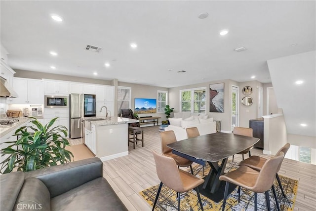 40 Riverton St, Phillips Ranch, CA 91766 - dining room featuring wood finish floors and recessed lighting