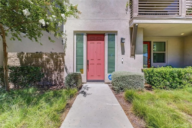 40 Riverton St, Phillips Ranch, CA 91766 - entrance to property featuring stucco siding and a balcony