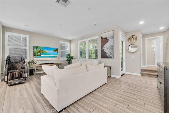 40 Riverton St, Phillips Ranch, CA 91766 - living area featuring light wood-style floors and recessed lighting