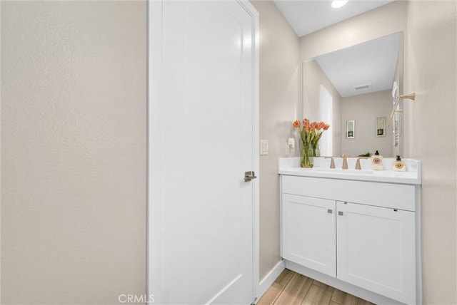 40 Riverton St, Phillips Ranch, CA 91766 - bathroom featuring vanity and wood finished floors