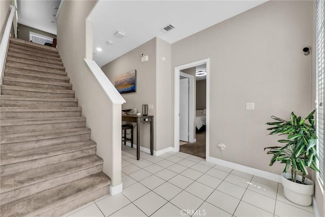40 Riverton St, Phillips Ranch, CA 91766 - stairs featuring baseboards and tile patterned floors
